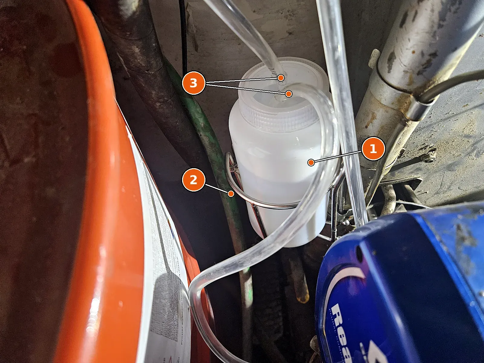 TSL bottle in a stainless holder on the proportioner.