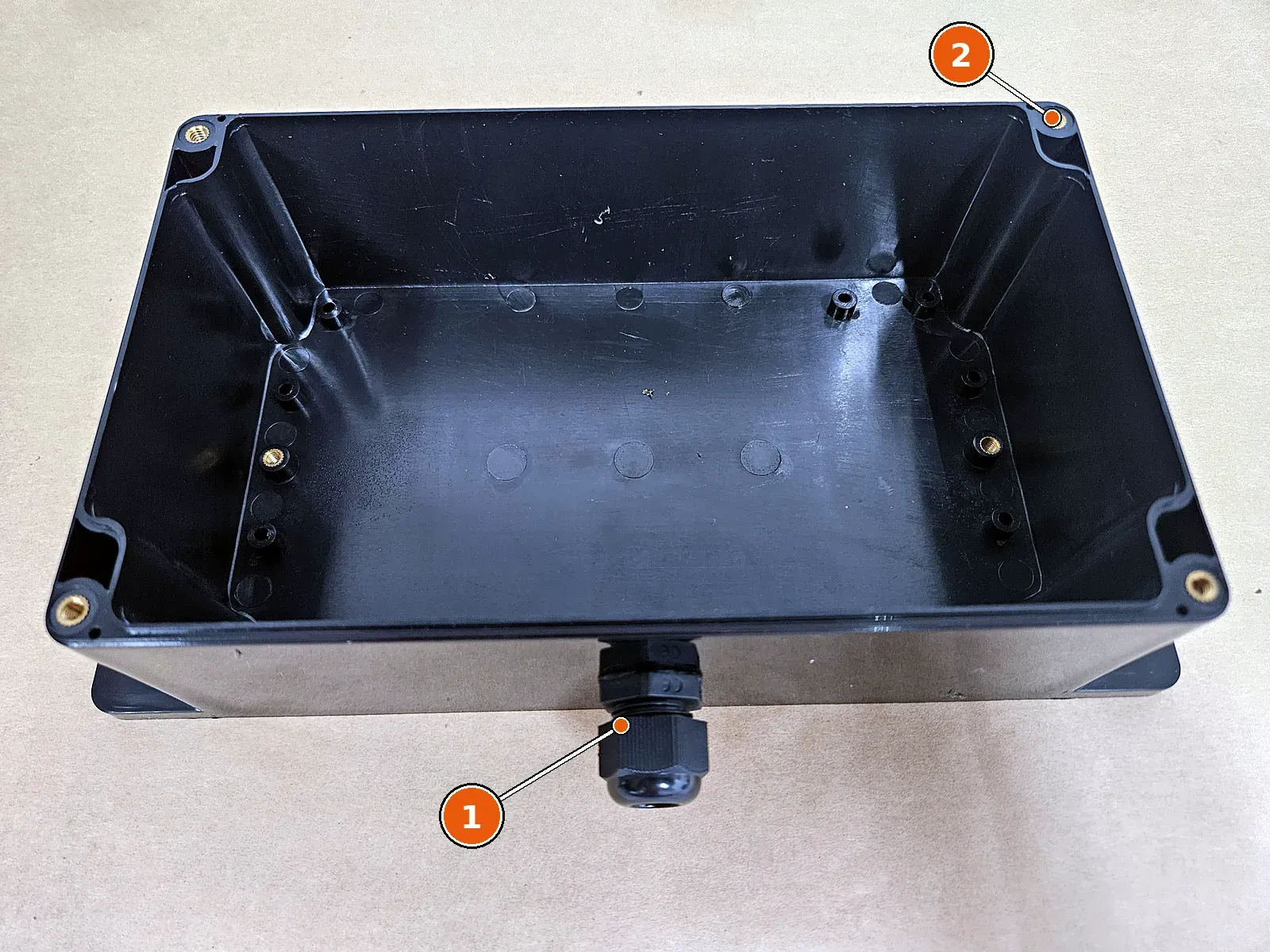 Cable gland in the enclosure base.