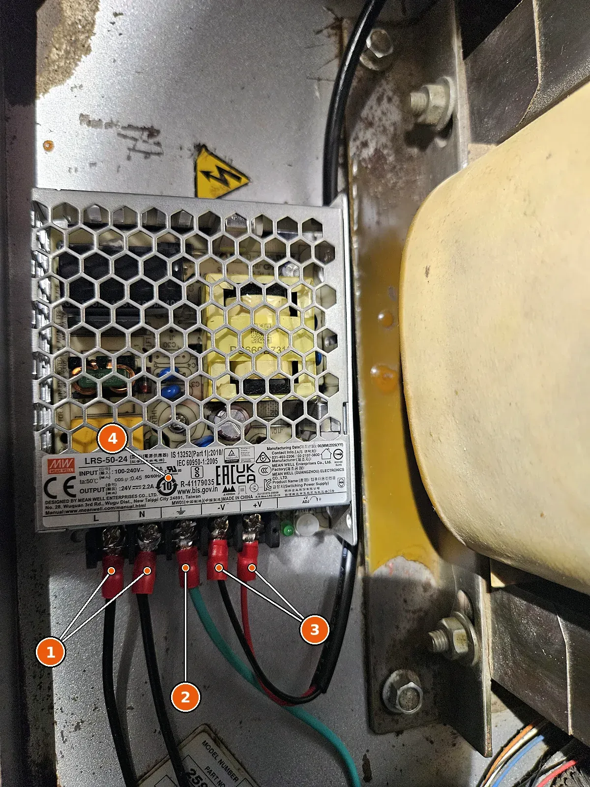 The 24 V supply mounted inside the reactor's electrical cabinet.