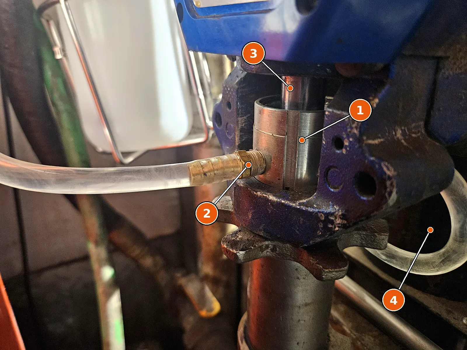 Brass barb in the A-side wet cup, with the clear line attached.